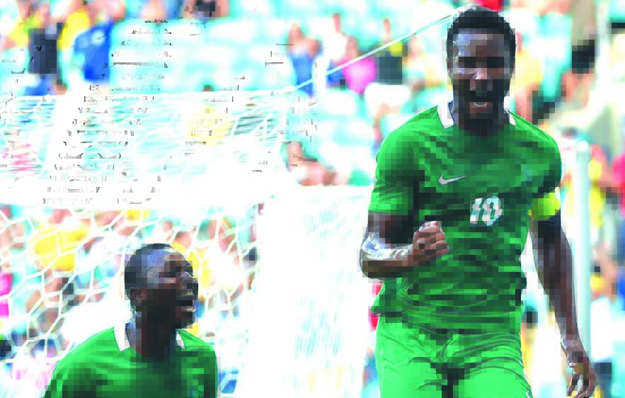 DTeam-John Obi Mikel (R) of Nigeria celebrates his goal scored against Denmark