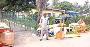 Eze with some of his belongings after his eviction