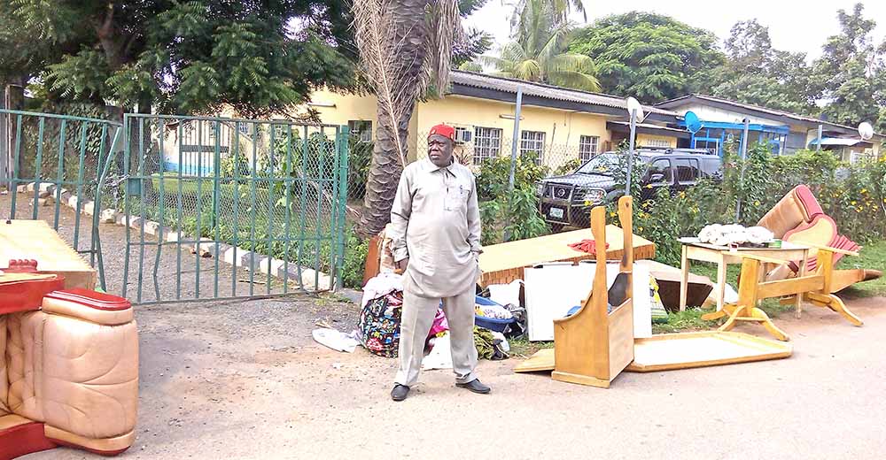 Eze with some of his belongings after his eviction
