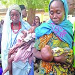 Women malnourished babies at an IDP camp in Borno