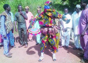 the-hunters-masquarade-dancing-and-singing-during-omu-cultural-day-festival-j