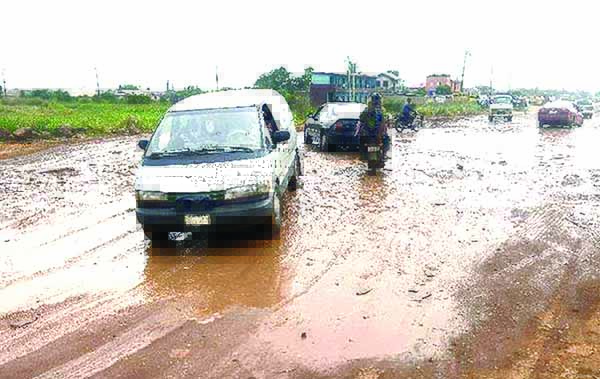Nigeria-.-Bad-roads.-Ikorodu-Shagamu-rd-Ogijo-Ogun-State-Oct-23-2014.-AFP-Photo.Pius-Utomi-Ekpei
