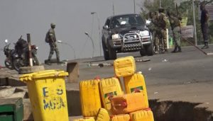A still image from video of soldiers who have taken control of Bouake standing at a checkpoint in Bouake