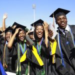 Students react during the Hampton University graduation ceremony