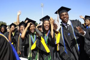 Students react during the Hampton University graduation ceremony