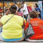 Women sit on bench in New York