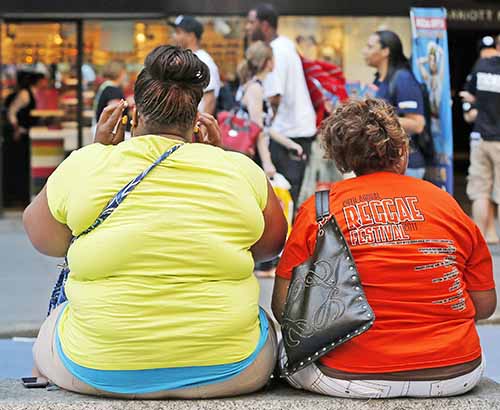Women sit on bench in New York