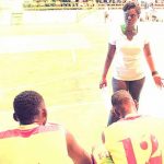 Brigitte dishing instructions to her players