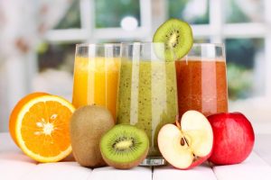 bigstock-fresh-fruit-juices-on-wooden-t-54817562-840×560