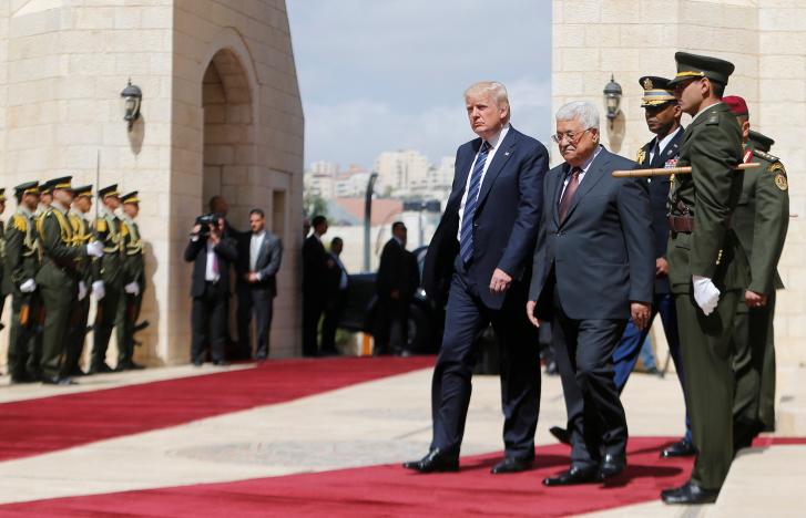 U.S. President Donald Trump and Palestinian President Mahmoud Abbas review the honor guard during a reception ceremony at the presidential headquarters in the West Bank town of Bethlehem