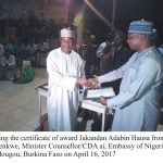 Burka Usman receiving his award from copy