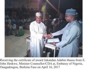 Burka Usman receiving his award from copy