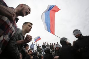 Demonstrators shout slogans during an anti-corruption protest in central St. Petersburg