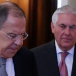 Russian Foreign Minister Lavrov and U.S. Secretary of State Tillerson enter hall during their meeting in Moscow