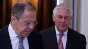Russian Foreign Minister Lavrov and U.S. Secretary of State Tillerson enter hall during their meeting in Moscow