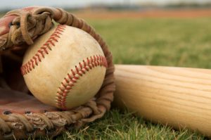 Baseball in a Glove near Bat