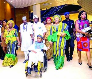 Kogi gov wife Amina with son Hayat on wheelchair arriving venue
