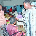 Pastor Ayodele of Dunamis Gospel Kubwa praying with inmate