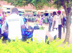 Members of NOA with the school pupils during the exercise