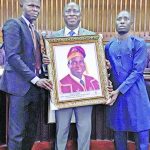 Outgoing VC, Unilag,Akoka, Prof Rahamon Bello receiving a plaque from Education Writers Association of Nigeria (EWAN), President, Bosun Ogundare and Secretary, Mojeed Alabi at the Senate Chambers
