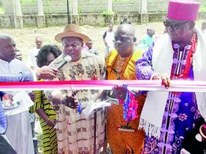 Rev. Fr Collins Ojene, Hon. Lasbry Amadi, Hon. Somtochukwu Udeze and Igwe Ngoddy while commissioning the project
