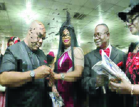 (l-r) Sir Afam Obi and wife Lady Tussy Obi and another couple at the event