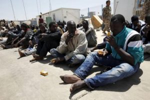 Illegal migrants who attempted to flee the coast to Europe are seen at the Libyan Navy base in the the coastal city of Tripoli
