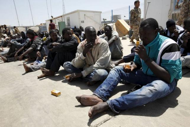 Illegal migrants who attempted to flee the coast to Europe are seen at the Libyan Navy base in the the coastal city of Tripoli