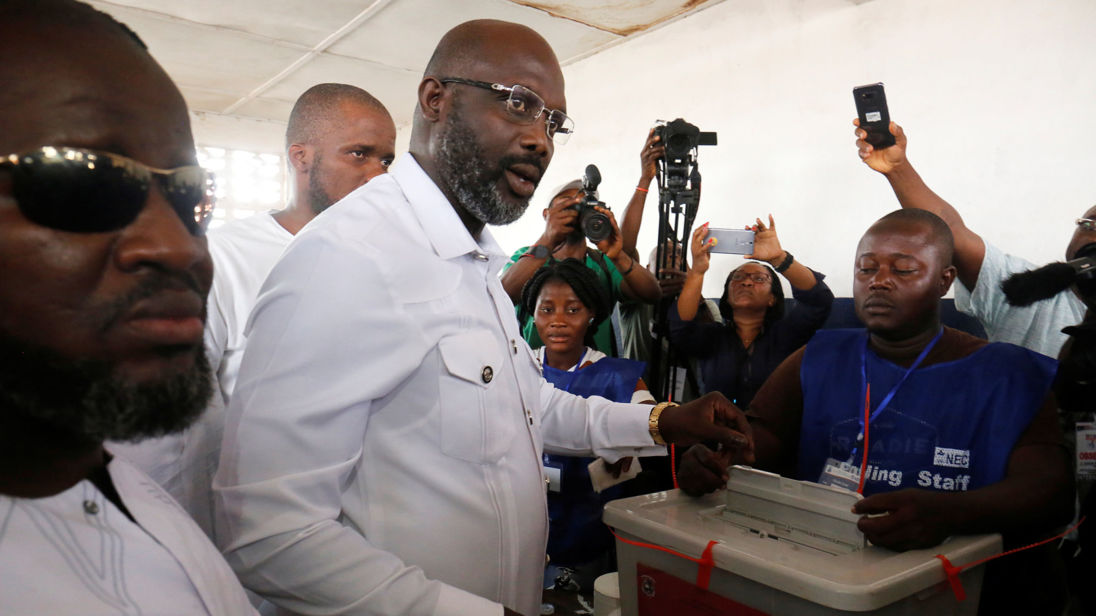 George Weah, former soccer player and presidential candidate of Congress for Democratic Change (CDC), votes at a polling station in Monrovia