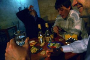 Men drink vodka in a cafe in Moscow, Russia, Friday, Februar