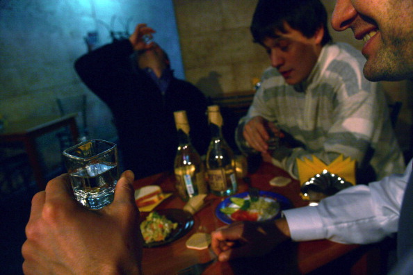 Men drink vodka in a cafe in Moscow, Russia, Friday, Februar