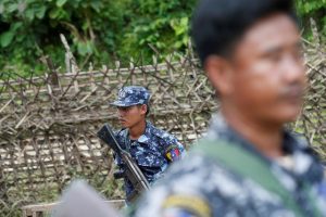 Polices guard near a bridge after Arakan Rohingya Salvation Army (ARSA) attacked, in Buthidaung