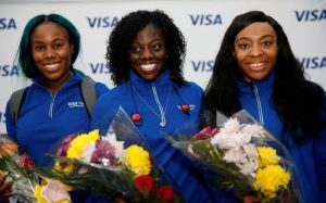 Nigerian Women’s Bobsled Team Ngozi Onwumere, Akuoma Omeoga and Seun Adigun pose with flowers upon their arrival in Lagos