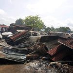 Some of the burnt cars and shops at the mechanic village