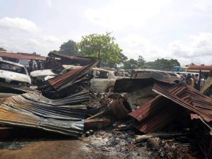 Some of the burnt cars and shops at the mechanic village