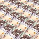 42923746-nigerian-nairas-bills-stacks-background-