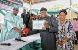 Fayemi-with-his-wife-Bisi-receives-the-Certificate-of-Return-from-INEC-National-Commissioner-Soyebi-e1531942340835