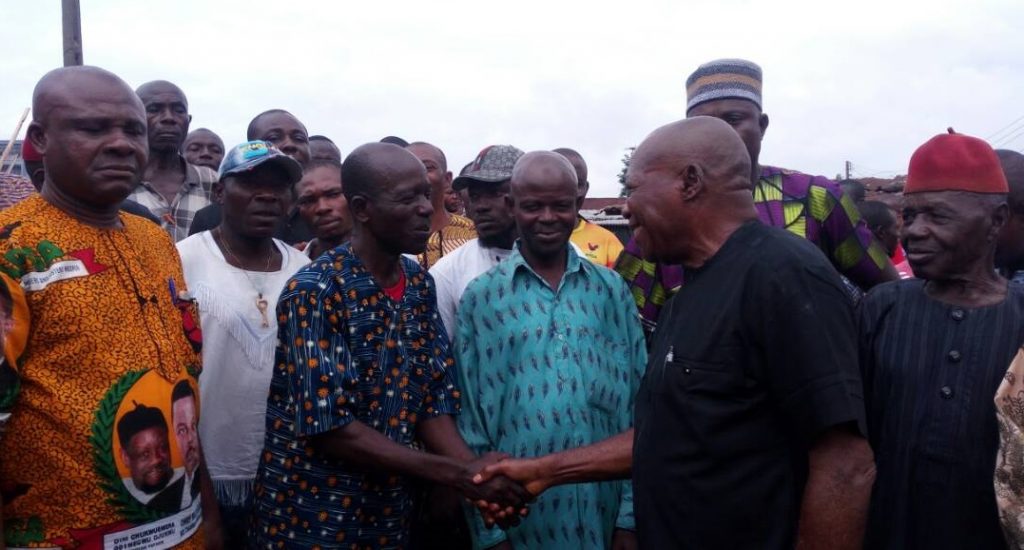 Newly elected executives of Okpoko community being congratulated by Mr Felix Onunkwo