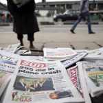 Newspapers are seen at a vendor’s stand along a road in Ikoyi district in Lagos