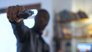 videoblocks-the-blurred-african-robber-aiming-with-the-gun-to-the-camera_bizivbpohg_thumbnail-full05