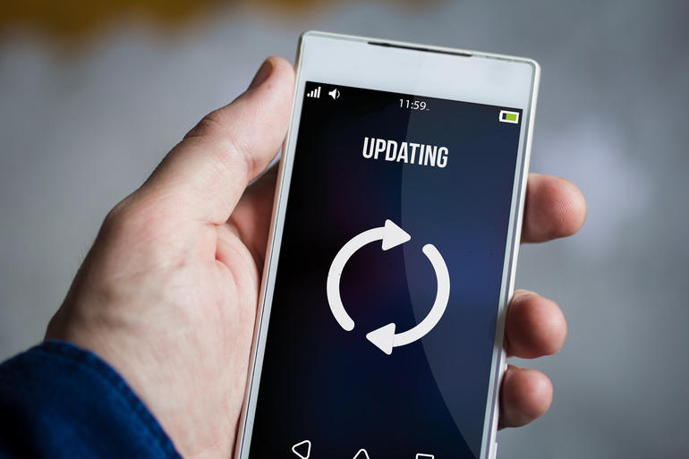 holding updating smartphone