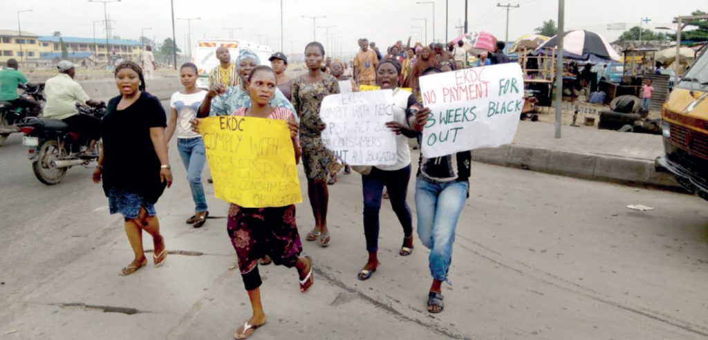 Women marching to the EKEDC office during the protest