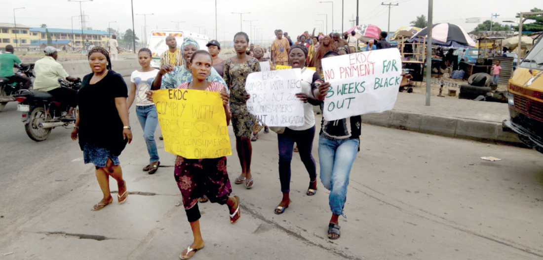 Women marching to the EKEDC office during the protest