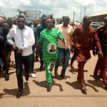 Atigwe in the middle with hordes of supporters heading to the declaration