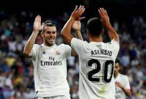 FILE PHOTO: Real Madrid’s Gareth Bale celebrates with Marco Asensio at Santiago Bernabeu, Madrid, Spain – August 19, 2018