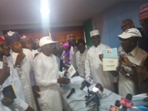 Buhari_nomination_cheque_of_N45m_to_Oshiomhole