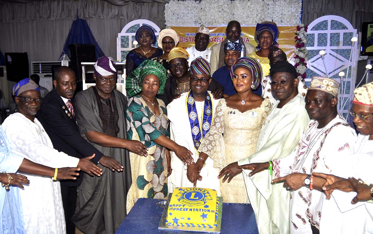 Lion Babalola middle with others during his public presentation
