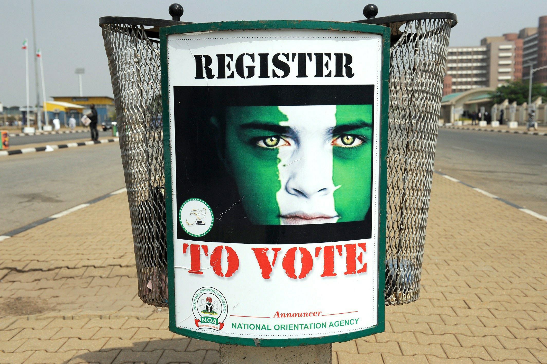 A poster reading ‘Register to vote’ is d