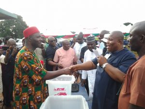 Senator Chuka Utazi receiving handshake from the Retuning Officer, Dr Nwatu after winning PDP ticket for Enugu North yesterday