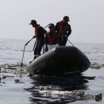 Indonesia plane crash search finds remains, debris at sea